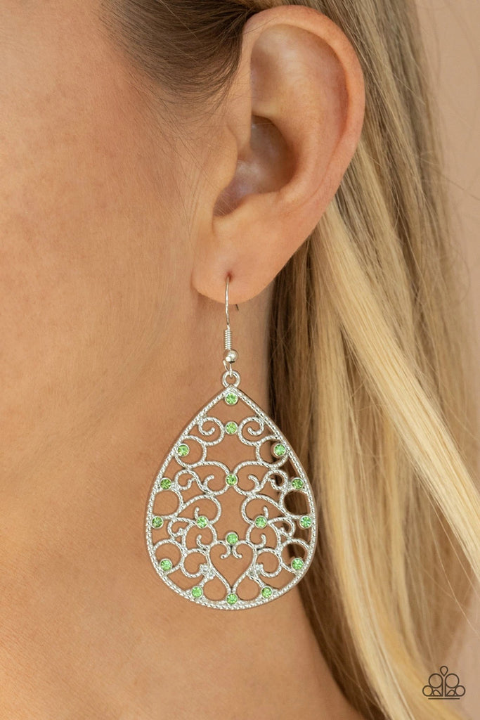 Dotted with dainty green rhinestones, studded silver filigree vines across the front of a silver teardrop frame for an enchanting look. Earring attaches to a standard fishhook fitting.  Sold as one pair of earrings.