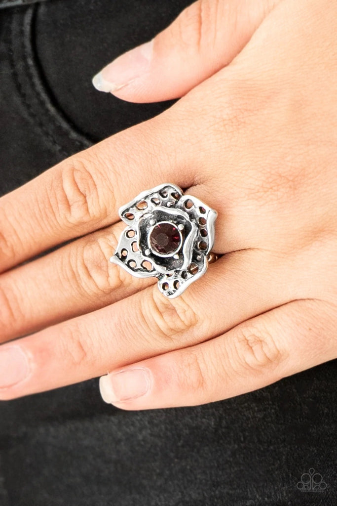 Featuring airy cut-out textures, antiqued silver petals gather around a glowing purple rhinestone center for a whimsical look. Features a stretchy band for a flexible fit.  Sold as one individual ring.