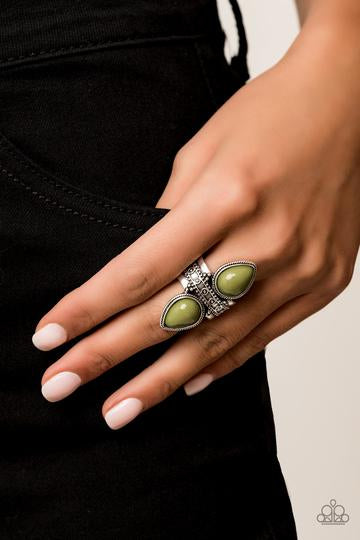 Tinted in the zesty green hue of Guacamole, polished teardrop beads flank an ornately studded silver band for a trendsetting look. Features a stretchy band for a flexible fit.  Sold as one individual ring.