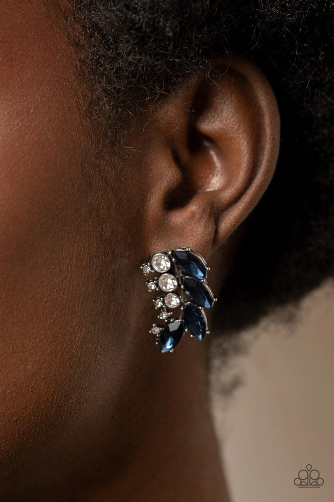 A frond of dazzling blue marquise and round white rhinestones delicately curves below the ear for a flawless finish. Earring attaches to a standard post fitting.  Sold as one pair of post earrings.