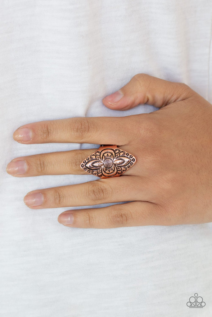 Stamped in floral patterns, a shimmery copper frame folds around the finger for a seasonal flair. Features a stretchy band for a flexible fit.  Sold as one individual ring.