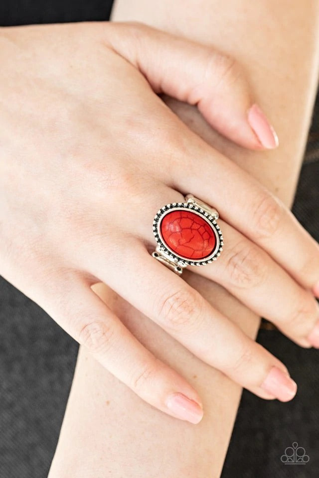 Chiseled into a smooth oval, a fiery red stone is pressed into the center of a studded silver frame for an artisan inspired look. Features a stretchy band for a flexible fit. Sold as one individual ring.