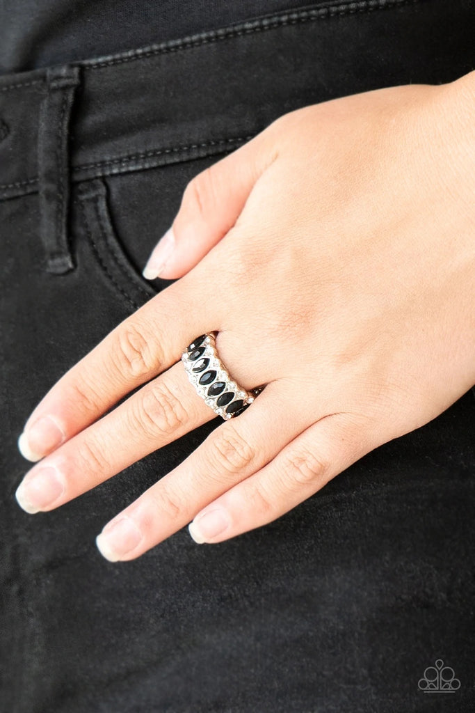 Featuring regal marquise style cuts, glittery black rhinestones are encrusted down the center of a silver band radiating with glassy white rhinestones for an edgy look. Features a stretchy band for a flexible fit.  Sold as one individual ring.
