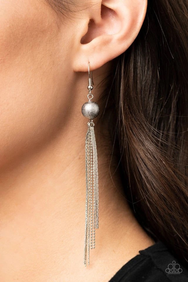 A silver foiled bead gives way to matching flattened and dainty ball chains, creating a sleek tasseled look. Earring attaches to a post fitting.  Sold as one pair of earrings.