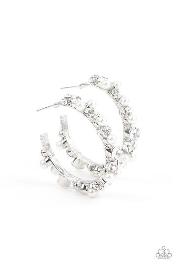 A bubbly array of classic white rhinestones and glassy white rhinestones are encrusted along the front of a silver hoop, creating an elegantly effervescent look. Earring attaches to a standard post fitting. Hoop measures approximately 1 1/2" in diameter.  Sold as one pair of hoop earrings.