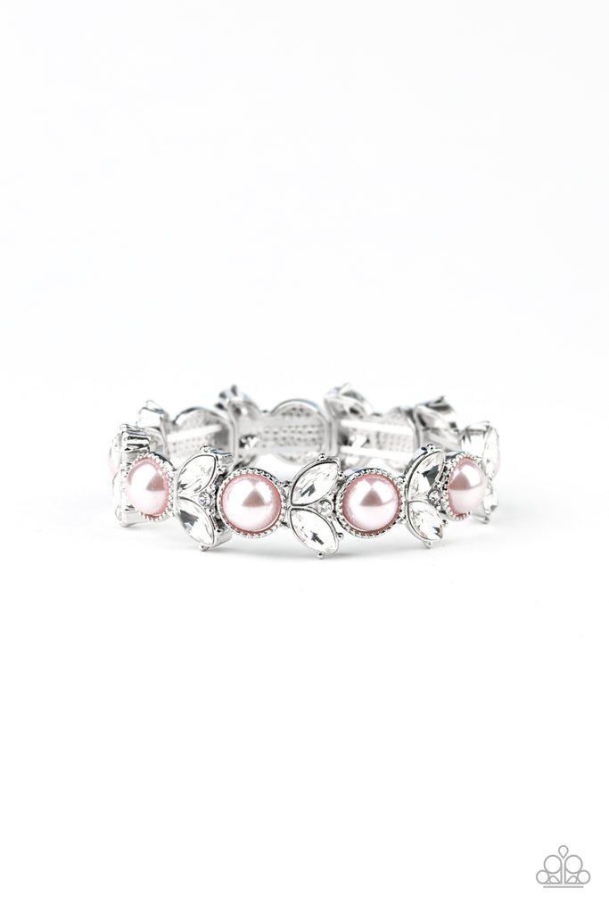 Encrusted in dazzling white rhinestones and an oversized pink pearl, leafy silver frames are threaded along stretchy bands around the wrist for a timeless look.  Sold as one individual bracelet.