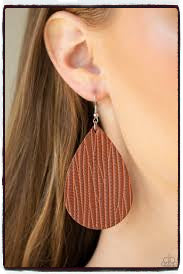 Stamped in an animal print inspired pattern, an earthy leather teardrop swings from the ear for a trendy vibe. Earring attaches to a standard fishhook fitting.  Sold as One pair of earrings